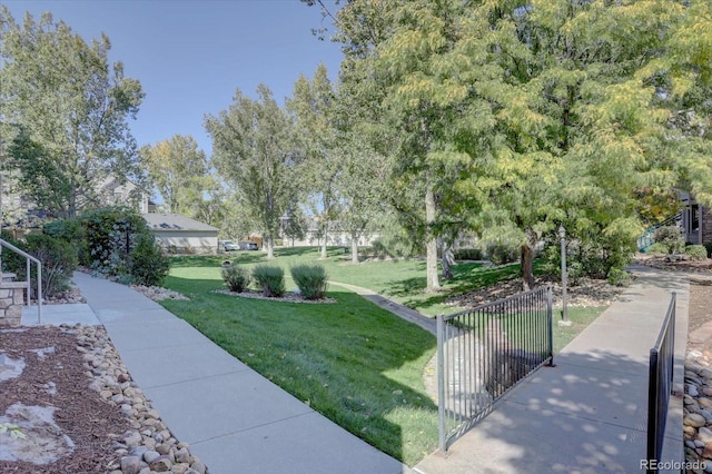 9448 E Florida Ave Unit 1078, Denver, CO 80247 - view of community with fence and a yard