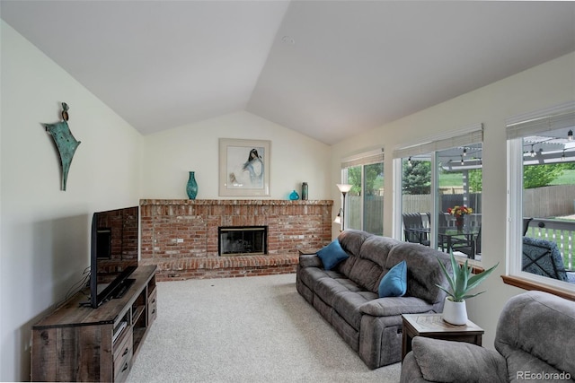 1825 Keota Ln, Superior, CO 80027 - living room featuring a fireplace, vaulted ceiling, carpet flooring, and healthy amount of natural light