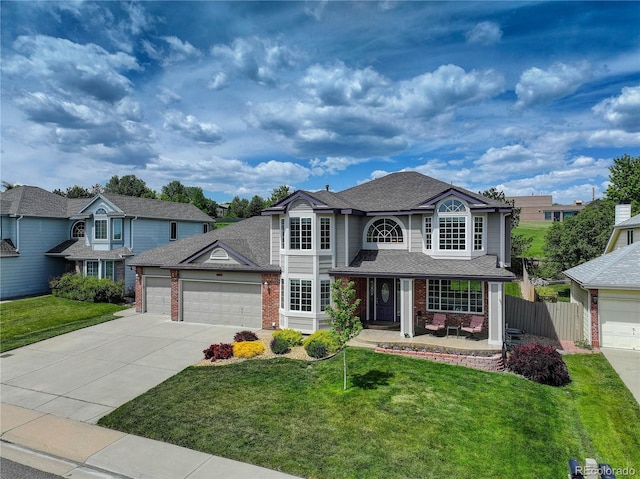 1825 Keota Ln, Superior, CO 80027 - traditional-style home featuring a garage, brick siding, driveway, a porch, and a shingled roof