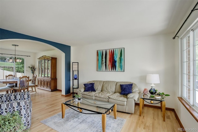 1825 Keota Ln, Superior, CO 80027 - living area featuring light wood-type flooring, healthy amount of natural light, and baseboards
