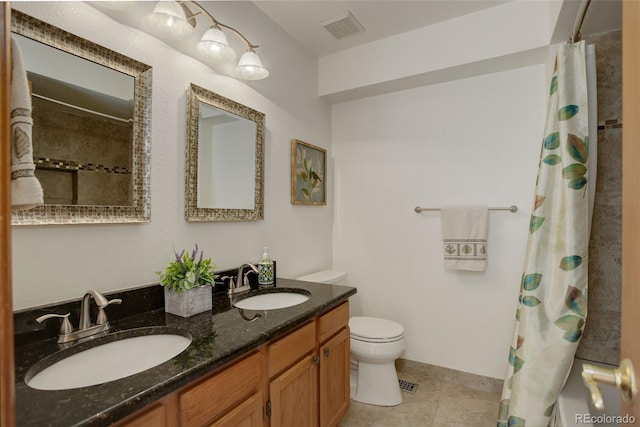 1825 Keota Ln, Superior, CO 80027 - bathroom with toilet, double vanity, and tile patterned floors