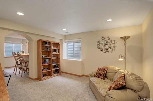 1825 Keota Ln, Superior, CO 80027 - carpeted living room with arched walkways, baseboards, and recessed lighting