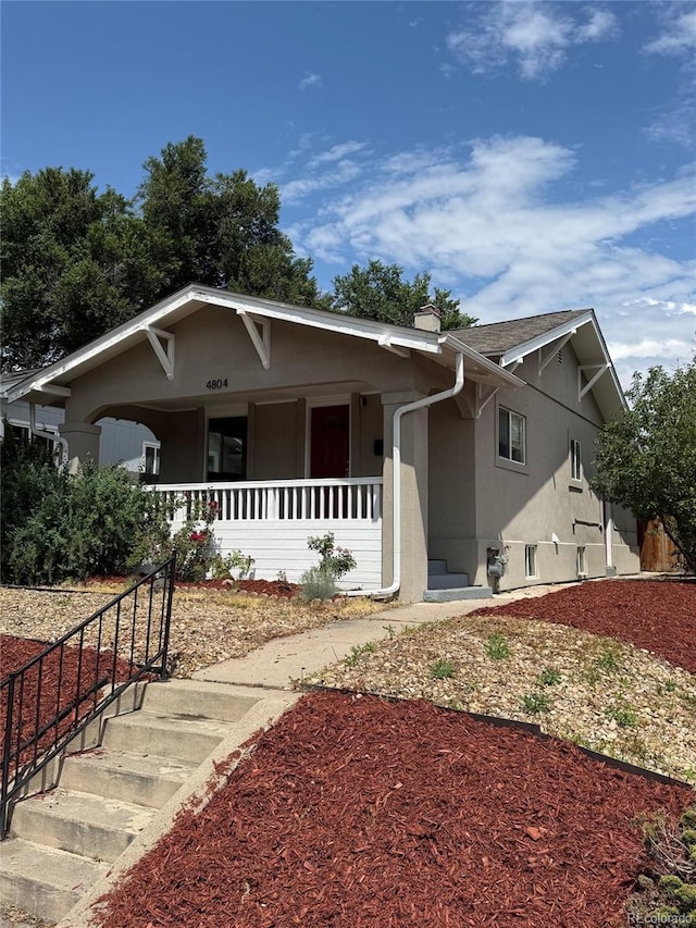 4804 N Raleigh St, Denver, CO 80212 - view of front facade featuring covered porch and stucco siding