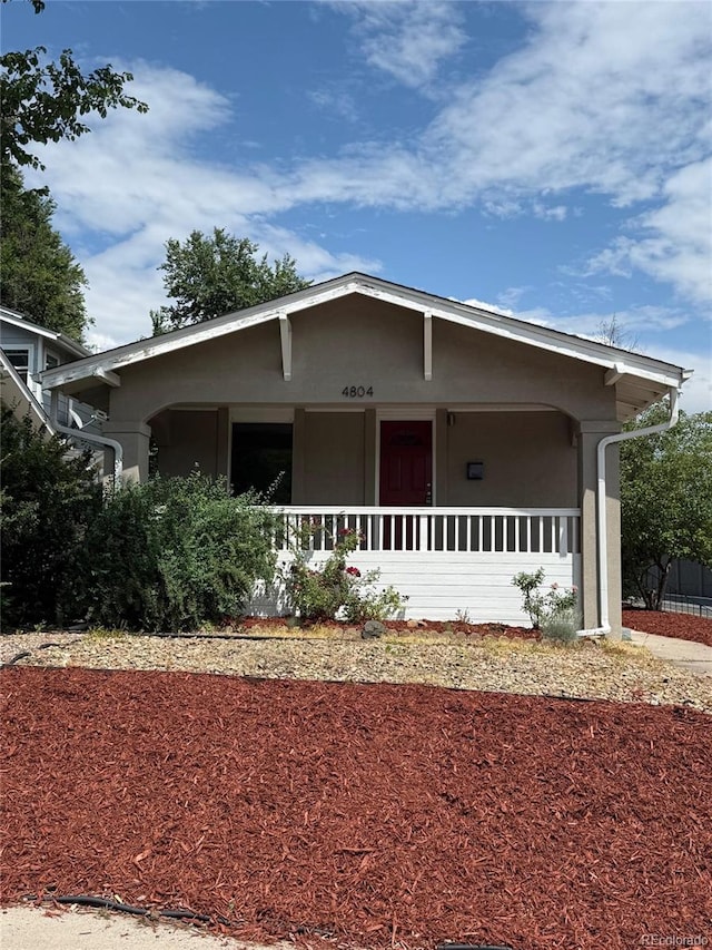 4804 N Raleigh St, Denver, CO 80212 - ranch-style house with stucco siding and a porch