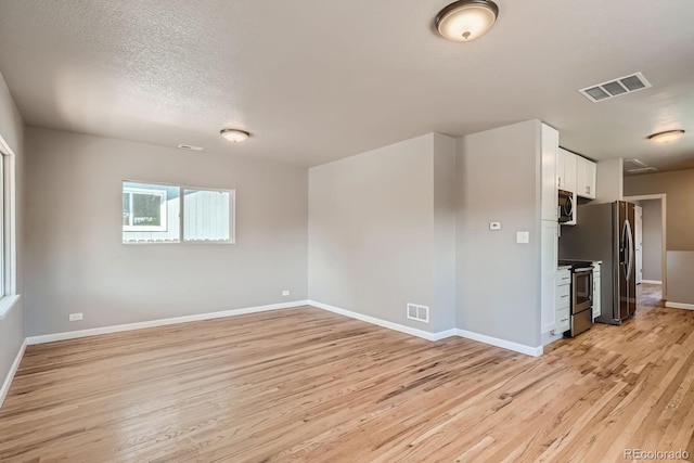 4804 N Raleigh St, Denver, CO 80212 - unfurnished room with light wood finished floors and baseboards
