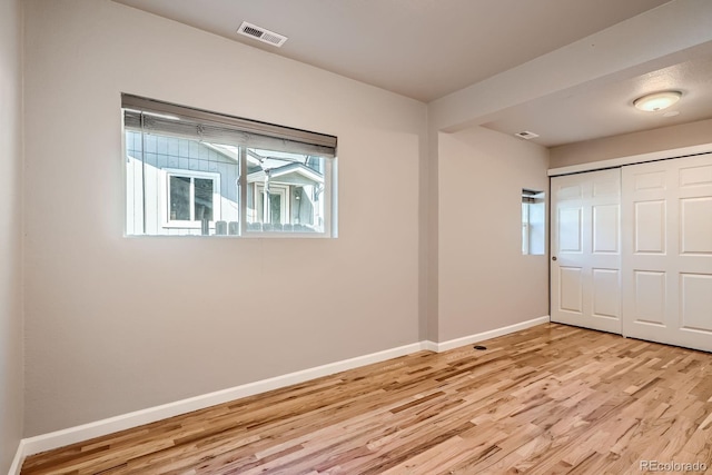 4804 N Raleigh St, Denver, CO 80212 - unfurnished bedroom featuring light wood-type flooring and a closet