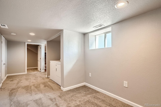 4804 N Raleigh St, Denver, CO 80212 - basement featuring light colored carpet, a textured ceiling, washer / dryer, and recessed lighting