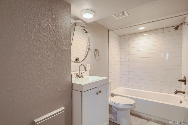 4804 N Raleigh St, Denver, CO 80212 - bathroom featuring a textured wall, vanity,  shower combination, and tile patterned flooring