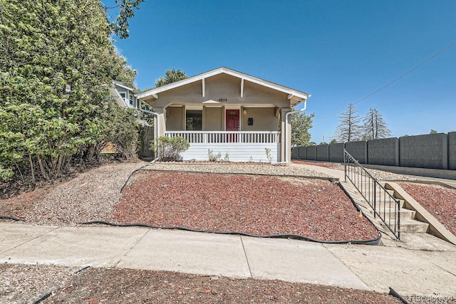4804 N Raleigh St, Denver, CO 80212 - bungalow featuring a porch and stucco siding