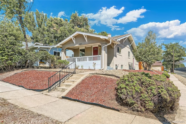4804 N Raleigh St, Denver, CO 80212 - view of front of house featuring stucco siding and a porch