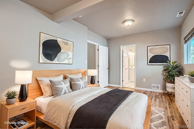 4804 N Raleigh St, Denver, CO 80212 - bedroom featuring light wood-type flooring and ensuite bathroom