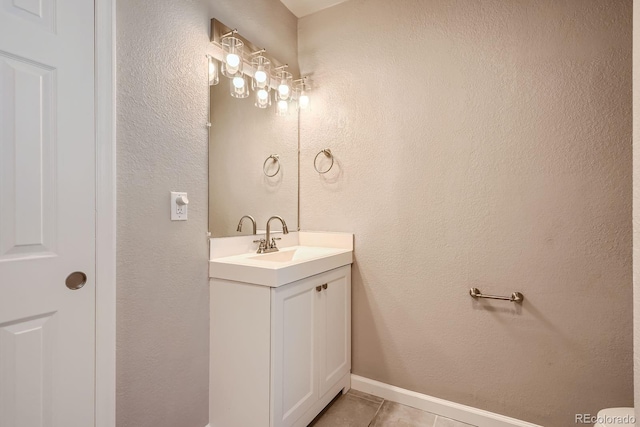 4804 N Raleigh St, Denver, CO 80212 - bathroom featuring vanity, tile patterned flooring, and a textured wall