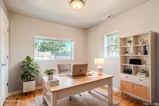 4804 N Raleigh St, Denver, CO 80212 - home office with light wood-style floors and baseboards