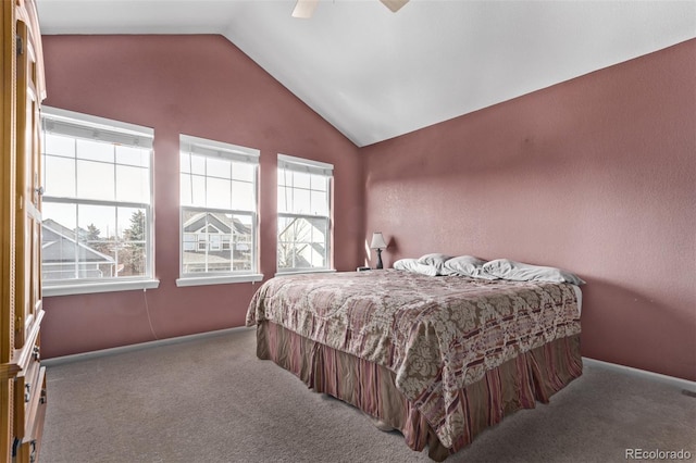 bedroom featuring ceiling fan, carpet, and vaulted ceiling