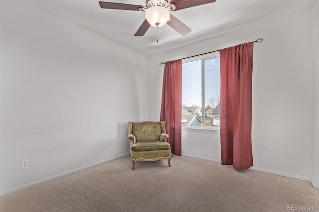 sitting room featuring ceiling fan and light colored carpet