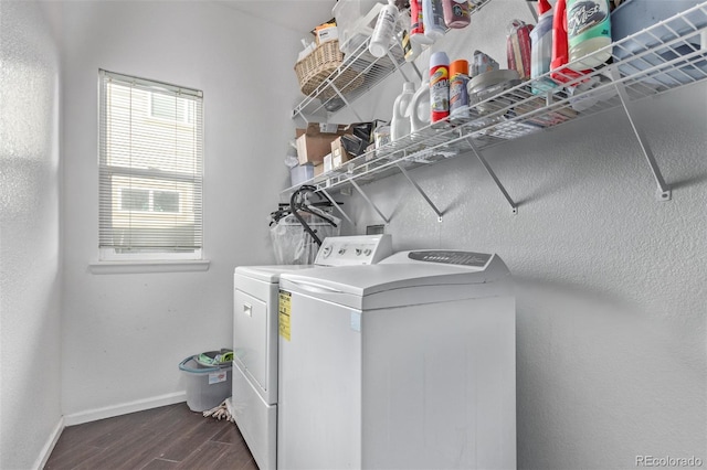 laundry area with washing machine and dryer and dark wood-type flooring