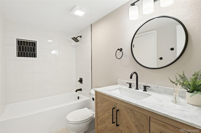 4274 S Salida Way Unit 3, Aurora, CO 80013 - bathroom with vanity, toilet, bathtub / shower combination, and a textured wall