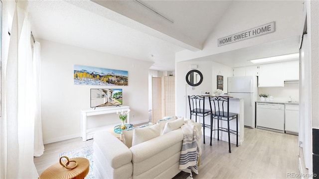 8701 Huron St Unit 1-207, Thornton, CO 80260 - living room with light wood finished floors and baseboards