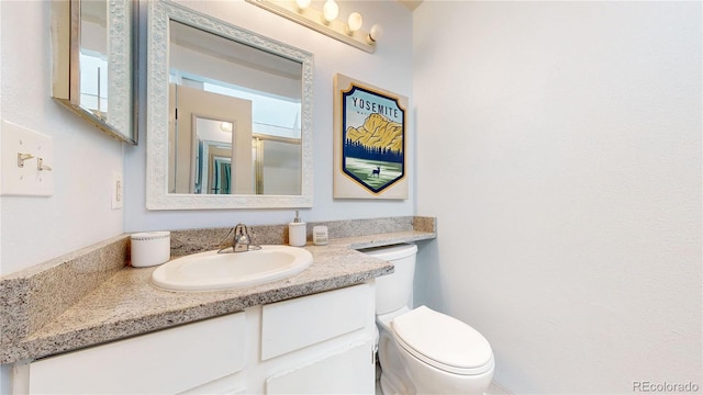 8701 Huron St Unit 1-207, Thornton, CO 80260 - bathroom featuring vanity and toilet