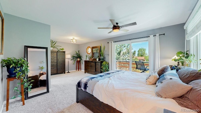 bedroom with light carpet, access to exterior, and baseboards
