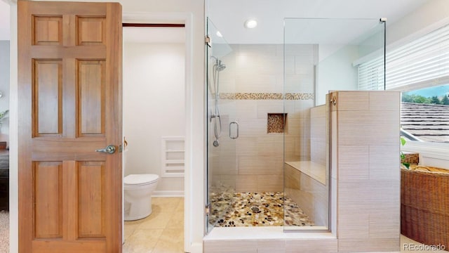 bathroom featuring a stall shower, tile patterned floors, toilet, and recessed lighting