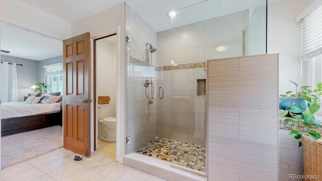 bathroom featuring a shower stall, ensuite bath, healthy amount of natural light, and toilet
