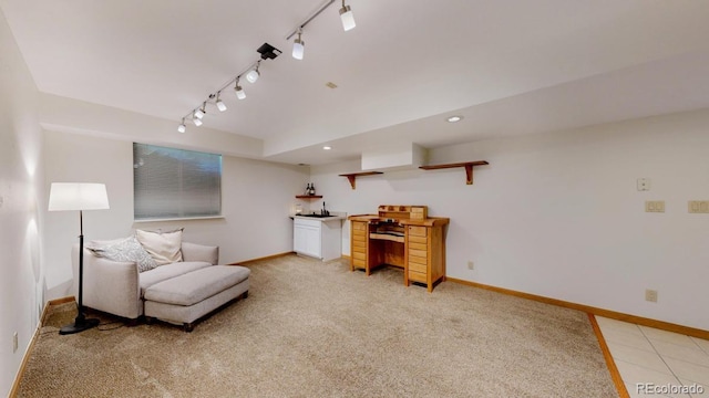 living area featuring baseboards, track lighting, light carpet, and recessed lighting