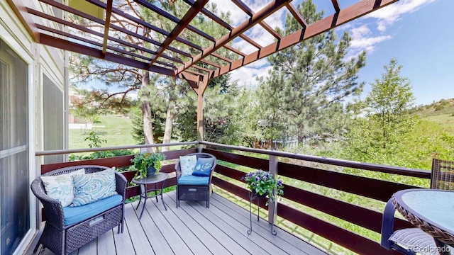 wooden terrace with a pergola