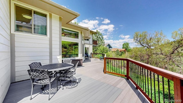 deck featuring outdoor dining area