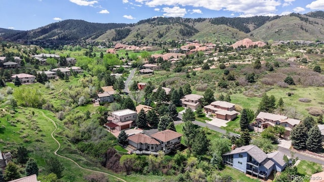 aerial perspective of suburban area with a mountainous background
