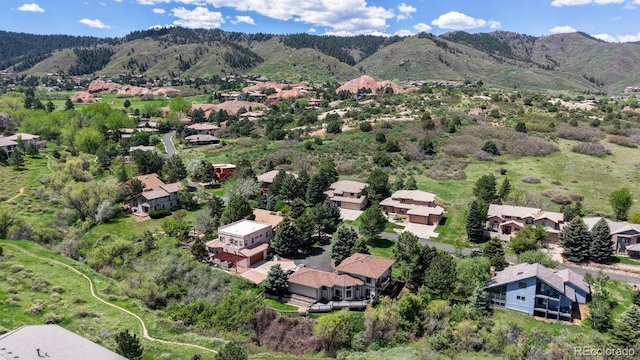 aerial perspective of suburban area featuring a mountainous background