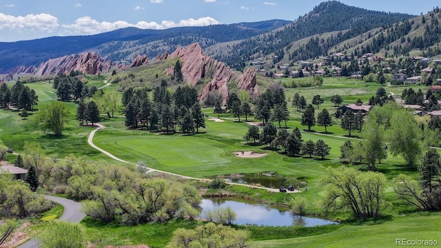 aerial view of a water and mountain view and a golf course