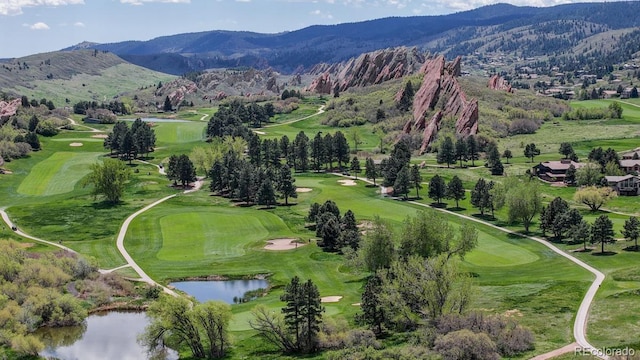 bird's eye view of a water and mountain view and a golf course