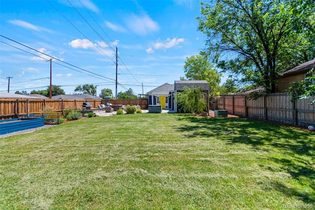 1390 Emporia St, Aurora, CO 80010 - fenced backyard with an outdoor structure