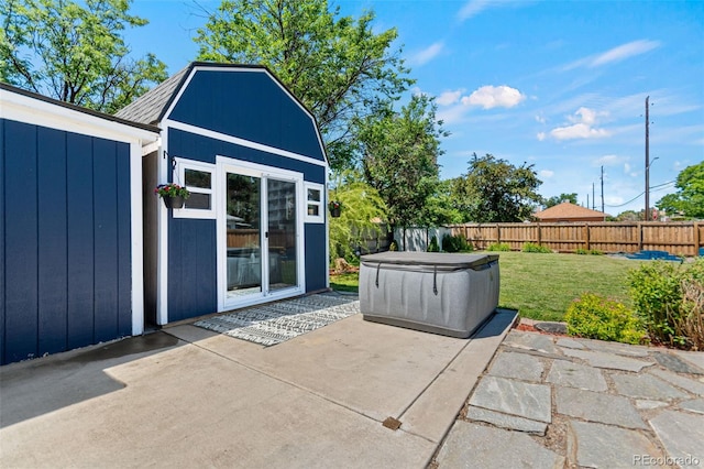 1390 Emporia St, Aurora, CO 80010 - view of patio / terrace with a hot tub and an outbuilding