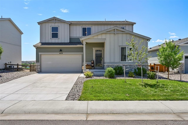 craftsman-style home with a garage and a front yard