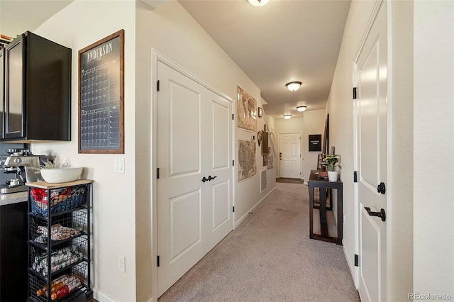 corridor with light colored carpet