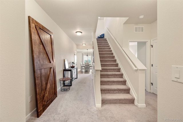 stairway with light carpet