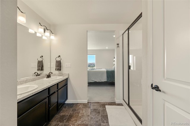 bathroom featuring tile patterned flooring, double sink vanity, and an enclosed shower