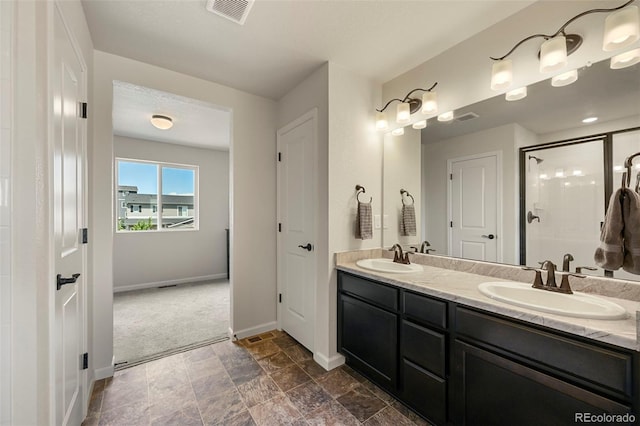 bathroom with dual vanity and tile patterned floors