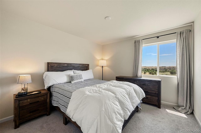 bedroom featuring light colored carpet