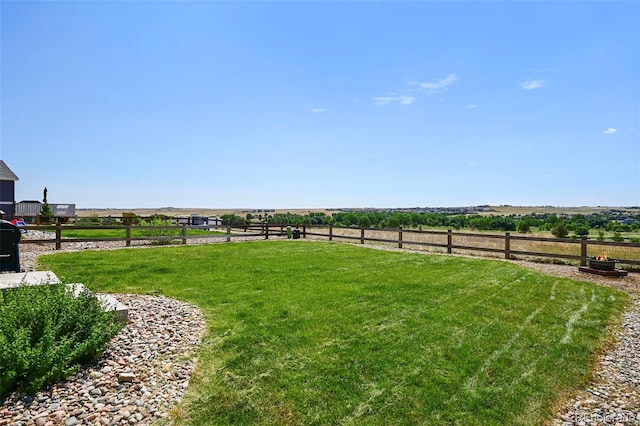 view of yard with a rural view