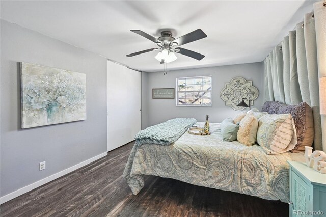 bedroom with baseboards, a ceiling fan, and wood finished floors