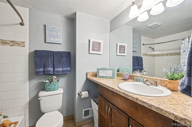 bathroom featuring visible vents, tile patterned flooring, toilet, and vanity