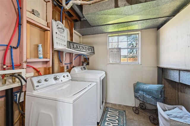 washroom with laundry area and washer and dryer