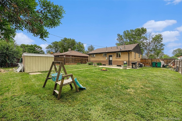 7625 Turner Dr, Denver, CO 80221 - fenced backyard featuring a storage shed, a patio area, and a fire pit