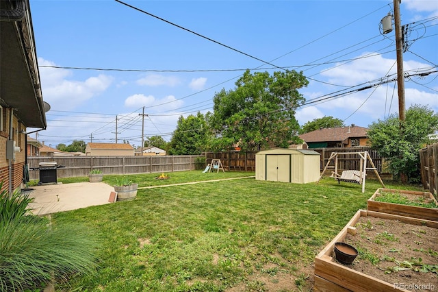 7625 Turner Dr, Denver, CO 80221 - fenced backyard featuring a shed, a vegetable garden, a patio area, and a playground