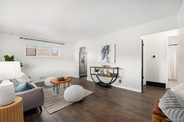 7625 Turner Dr, Denver, CO 80221 - living room with dark wood-style flooring and baseboards