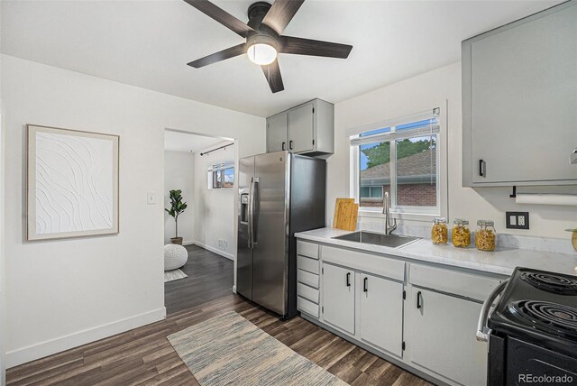 7625 Turner Dr, Denver, CO 80221 - kitchen with stainless steel fridge with ice dispenser, a ceiling fan, light countertops, dark wood-style floors, and gray cabinetry