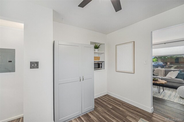 7625 Turner Dr, Denver, CO 80221 - hallway featuring electric panel and dark wood finished floors